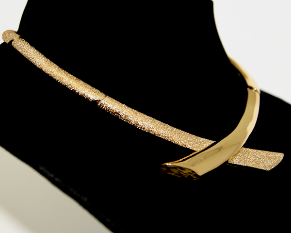 1970's MONET textured and smooth gold articulated crossover necklace